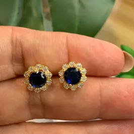 BRINCO PEDRA AZUL COM CRAVEJADOS OURO