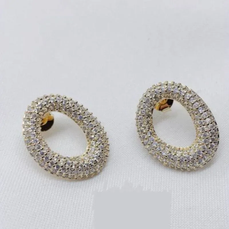 BRINCO OVAL ZIRCONIA RODIO BRANCO