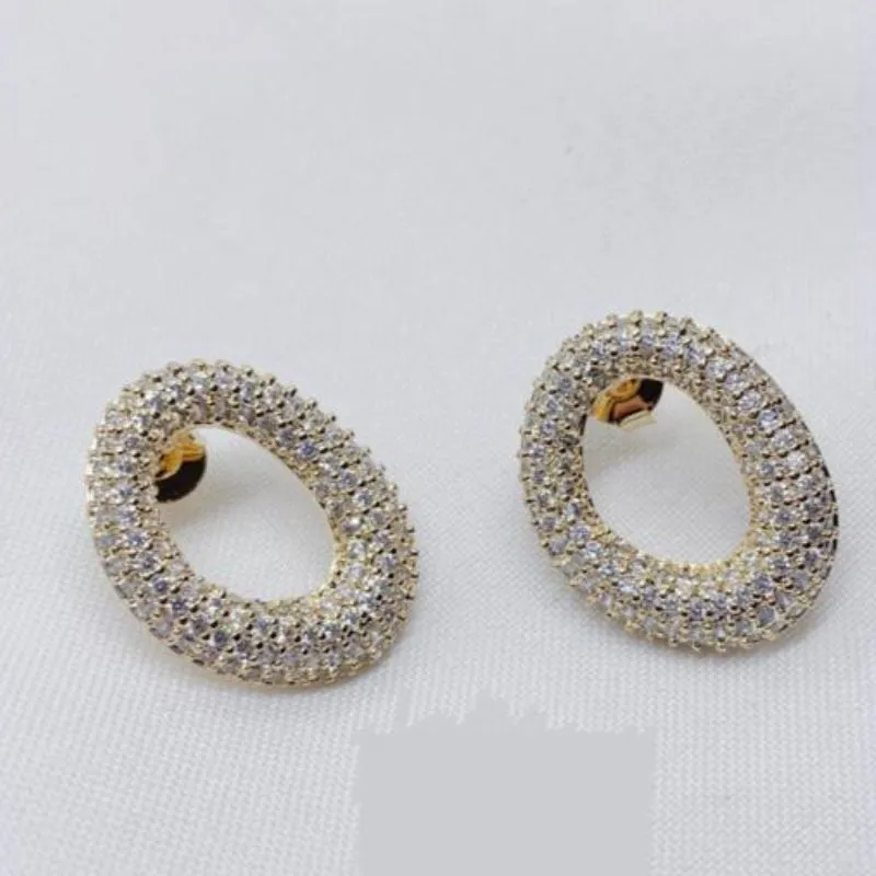 BRINCO OVAL ZIRCONIA RODIO BRANCO